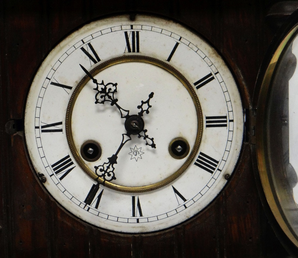 A BLACK-FOREST MANTEL CLOCK BY JUNGHANS with carved dome top, circular dial bearing Roman - Image 2 of 2