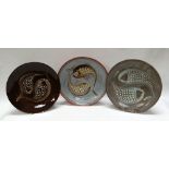 A WILLIAM FISHLEY HOLLAND STUDIO POTTERY TRIO of circular dishes sgraffito and relief decorated with