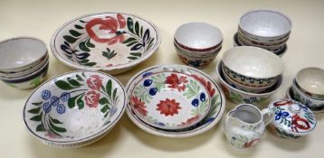 A COLLECTION OF SPONGEWARE POTTERY BOWLS, a similar jug and covered bowl (some damage)