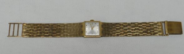 A RECORD DE LUXE 9CT GOLD WRISTWATCH with square silvered dial, 42.9gms gross