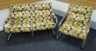 A TUBULAR STEEL AND UPHOLSTERED TWO SEATER SOFA AND ARM CHAIR circa 1960/1970s in geometric velvet