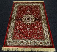 RED GROUND KASHMIR RUG SHAHBAZ DESIGN, 117 x 168cms