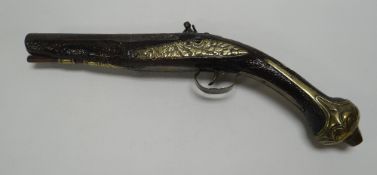 A SPANISH FLINTLOCK PISTOL, brass mounted with carved barrel, believed to be eighteenth century,