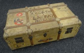 A MALLES COSMOPOLIS CABIN TRUNK with timber banding, leather carry handles and with numerous early