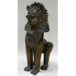 A CHINESE BRONZE STANDING DOG OF FO CREATURE 28cms high