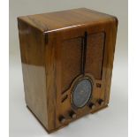 A FERGUSON FOUR BAND CABINET RADIO in an Art Deco polished case, 51cms high