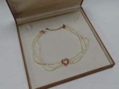 A CASED CLOGAU GOLD PEARL & 9CT ROSE GOLD CHOKER