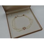 A CASED CLOGAU GOLD PEARL & 9CT ROSE GOLD CHOKER