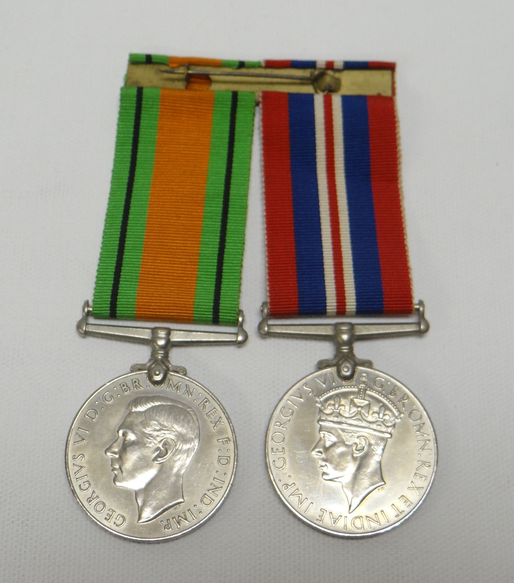 A 1939-45 DEFENCE MEDAL & A 1939-45 CAMPAIGN MEDAL, both with ribbons, uninscribed but awarded to - Image 2 of 2