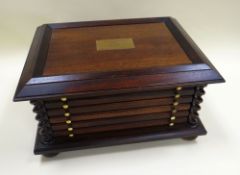 A MODERN SIX-DRAWER MEDAL COLLECTOR'S CABINET