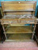 A FRENCH OAK THREE TIER DUMB WAITER with metamorphic top, a carved edge lift-up top opening to