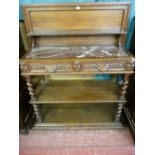 A FRENCH OAK THREE TIER DUMB WAITER with metamorphic top, a carved edge lift-up top opening to