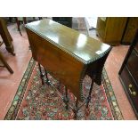 A CIRCA 1900 SPIDER LEG TABLE with slim rectangular top and shaped drop leaves, decorative side