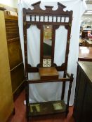 AN EDWARDIAN MAHOGANY HALL STAND with narrow mirror and tile back to a hinged glove box with