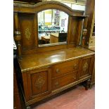 A 1930's OAK MIRROR BACK SIDEBOARD with carved decoration, bulbous shelf and lower supports, 176 x