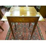 A REGENCY MAHOGANY SIDE TABLE with quarter veneered top having a central oval panel, crossbanded and