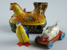 THREE TINPLATE ANIMAL TOYS, a well lithographed wind-up egg laying chicken by Balderman's