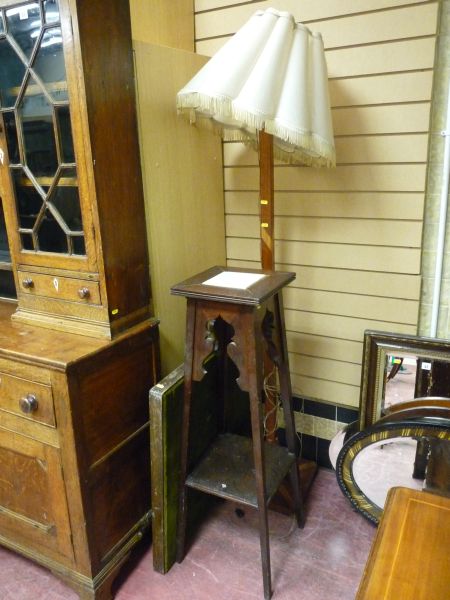 AN EDWARDIAN TWO TIER PLANT STAND with an Art Deco standard lamp having a velum shade and a