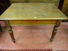 A VICTORIAN PITCH PINE FARMHOUSE TABLE, 76 cms high, 117 cms wide, 88 cms deep