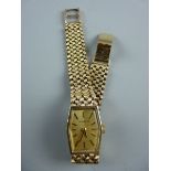 A LADY'S NINE CARAT GOLD MARVIN WRISTWATCH, six sided with incorporated woven bracelet, 27 grms