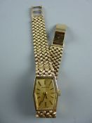 A LADY'S NINE CARAT GOLD MARVIN WRISTWATCH, six sided with incorporated woven bracelet, 27 grms