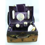 A LADY'S SILVER COMPACTUM, the case in quality deep purple leatherette, marked Mappin & Webb, only