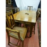 A CIRCA 1900 OAK DINING TABLE & SIX (four plus two) CHAIRS, a wind-out dining table with one extra