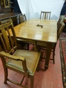 A CIRCA 1900 OAK DINING TABLE & SIX (four plus two) CHAIRS, a wind-out dining table with one extra