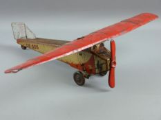 AN EARLY TINPLATE AIRPLANE, a single prop clockwork model, nicely lithographed with images of