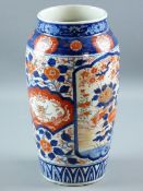 A JAPANESE IMARI DECORATED VASE, 32 cms high with panels of birds amongst flowers, with gilt