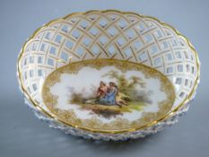 AN OVAL WHITE GROUND DRESDEN DISH with deep and delicate lattice work border and with gilt