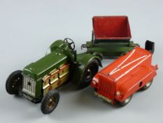 A TINPLATE BULLDOG TRACTOR in green livery with clockwork motor and rare side piston action,