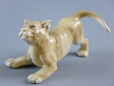 A RARE WADE LION CUB designed by Faust Lang, modelled in playful stance, marked to the foot 'Wade,