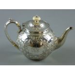 A LATE VICTORIAN SILVER BULLET SHAPED TEAPOT with bright cut embossed floral swags, ivory knop to