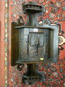 A BLACK FOREST STYLE OAK CORNER CABINET, wall hanging with central cupboard door having game bird