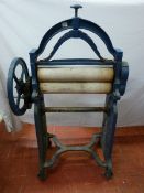 A VINTAGE CAST IRON MANGLE by S Aston & Son Ltd, Bangor, 132 cms high, 77 cms wide