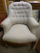 A CIRCA 1880 WALNUT ARMCHAIR, classically re-upholstered with button back and swept arms, well