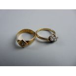 TWO RINGS, a twenty two carat gold signet ring with small centre diamond, 2.6 grms and an eighteen