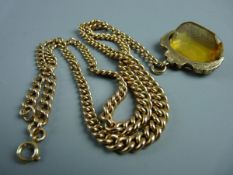 A NINE CARAT GOLD DOUBLE ALBERT with graduated links and with amber stone swivel fob, total 33 grms