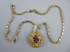 A BELIEVED NINE CARAT GOLD FIGARO CHAIN with garnet decorated star pendant, 5.5 grms