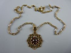 A YELLOW METAL ANTIQUE CHAIN WITH GARNET PENDANT, 9 grms gross