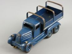 A CLOCKWORK TINPLATE TRUCK, six wheeler with front steering and trailer ribs, no visible markings,