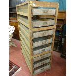 A PINE & WIREWORK EGG STORAGE RACK having eight sliding pull out drawers with brass label frames, 49