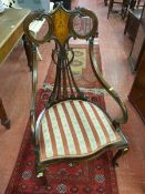 A CIRCA 1900 INLAID MAHOGANY ARMCHAIR, the inlaid and pierced splatback with carved flanking