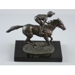 A BRONZE EQUESTRIAN SCULPTURE by David Cornell, believed to be a limited edition of Lester Piggott