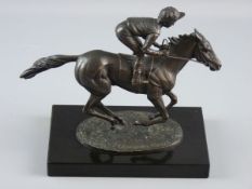 A BRONZE EQUESTRIAN SCULPTURE by David Cornell, believed to be a limited edition of Lester Piggott