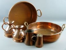 A PARCEL OF COPPERWARE comprising two circular twin handled copper cheese pans, 37 cms and 47 cms