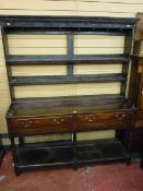 A 19th CENTURY OAK DRESSER in the Shropshire or Cardiganshire style having a three shelf rack over a