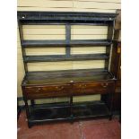 A 19th CENTURY OAK DRESSER in the Shropshire or Cardiganshire style having a three shelf rack over a