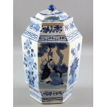 A CHINESE CERAMIC HEXAGONAL JAR & COVER in blue and white palette showing panels of an elder with